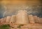 Derawar fort with old times wall of bricks and dramatic clouds and blue sky