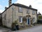 Derbyshire stone house on The Chatsworth Estate. Edensor, Derbyshire, England, UK. March 17, 2023.