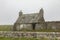 Derelict and broken sottish cottage on a misty day