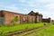 Derelict building and overgrown train tracks Birkenhead Docks Wirral August 2019