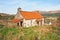 Derelict cottage with iron roof