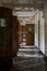 Derelict Hallway with Open Wood Doors - Abandoned Rockland State Hospital - New York