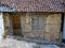 Derelict house with boarded up window