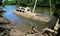 Derelict partially sunken boat in a creek