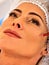 Dermal fillers of woman middle-aged in spa salon with beautician.