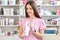 Dermatologist doctor holds cream in white tube. Attractive cosmetologist prepares for cosmetic procedures, ready for applying