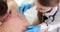 Dermatologist examines melanoma on body of patients