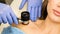 Dermatologist examines moles and birthmarks