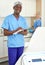 Dermatologist standing in salon of esthetic cosmetology, female on background