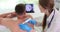 Dermatoscopy of moles, doctor examines patien back