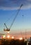 Derrick cranes at construction site
