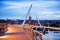 Derry, Ireland. Illuminated Peace bridge in Derry Londonderry, City of Culture, in Northern Ireland with city center at