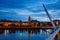 Derry, Ireland. Illuminated Peace bridge in Derry Londonderry, City of Culture, in Northern Ireland with city center at