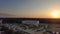 descending aerial footage of the Fredrick C. Hoboy Assembly Center on the campus of Grambling State University at sunset