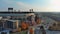 descending aerial footage of Guaranteed Rate Field baseball stadium at sunrise with buildings surrounded by autumn trees