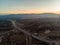 Desert asphalt road with cars. Aerial view from the top