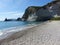 Desert beach with white cliffs looking on the sea to Ponza in Italy.