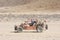 Desert buggy racing across ground