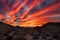 desert with colorful sunset, featuring streaks of red and orange in the sky