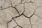 Desert dried and cracked ground. erosion earth background. cracked dry wall surface. white natural cracked texture. desert