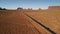 Desert, highway in Arizona, USA near the Oljatoâ€“Monument Valley, Utah. Sunset. Aerial view, from above, drone shooting. Arizona