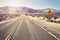 Desert highway with speed limit sign, USA.