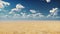 Desert horizon. Clear day. Mountains in the distance, sand dunes and blue sky. Beautiful scenery. Sand dunes and hot sky