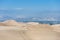 Desert in Huacachina, Peru. Buggy road and Mountain in background