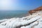 Desert landscape of Dead Sea coastline with white salt, Jordan, Israel.