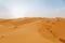 Desert landscape with orange dunes