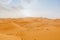 Desert landscape with orange dunes