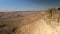 Desert Landscape over Mitzpe Ramon Crater in the Negev fly
