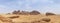 Desert landscape, sand, rocks and mountain panorama