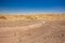 Desert landscape sand stone ground dry wasteland scenic view rocky hills horizon background Middle East Israeli warm region