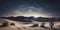 A desert landscape under a vast, star-studded night sky