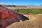 Desert landscape of village and volcanoes near San Pedro de Atacama, Chile, viewed from Pukara de Quitor, against a blue