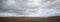 Desert-mountainous terrain . Blue sky with many white clouds. Desert and Mountain Landscape with Azerbaijan . Desert and blue sky