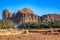 Desert mountains with ruins of Dadan and road with palms, Al Ula, Madain Salih, Saudi Arabia