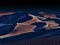 Desert of namib at night with orange sand dunes and starry sky