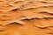 Desert orange sand dunes top view close up, yellow sand texture ornament, desert barchans background