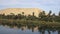 Desert and palm landscape view on Nile river cruise tour trip of Egypt