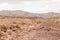 Desert, red mountains, rocks and cloudy sky. Egypt, color canyon