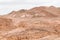 Desert, red mountains, rocks and cloudy sky. Egypt, color canyon