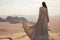 Desert Reverie: Middle Eastern Woman Embracing the Horizon\\\'s Vastness