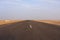 Desert road, dry salt lake Chott el Djerid in Tunisia