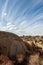 Desert rock formations with clouds in blue sky in Eastern Sierra Nevadas California