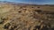 Desert and Rocks Aerial Shot of Alabama Hills and Inyo Mountains Death Valley California Backward