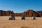 Desert safari, cars standing in front of rock formation, Chad