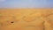 Desert Safari off-roading, group of jeep or SUV or 4x4 car vehicle rides on desert dune barkhan or sand-dune. Aerial