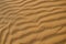 Desert sand blown by wind close up